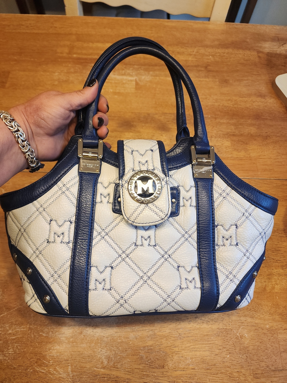 Metrocity leather handbag in white and navy with a quilted monogram pattern